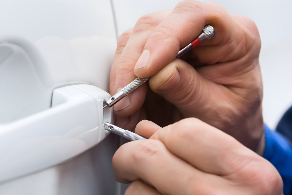 Close-up,Of,Person,Hand,Holding,Lockpicker,To,Open,Car,Door