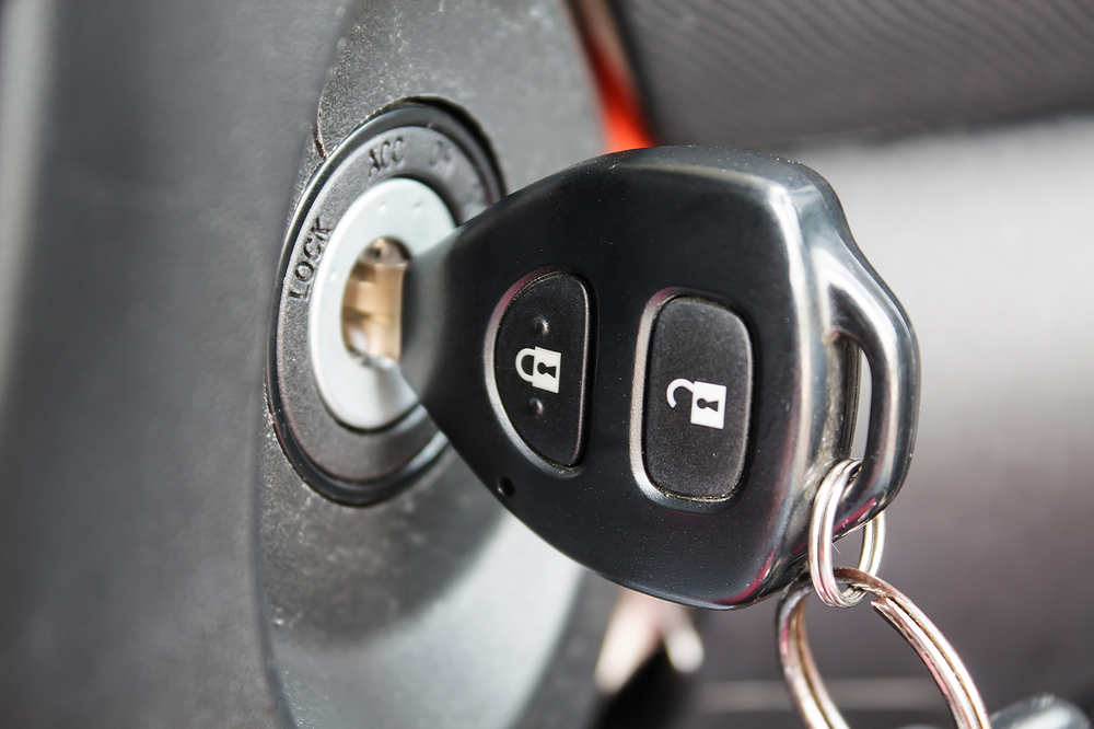 Car,Key,Inserted,Into,The,Lock,Of,Ignition